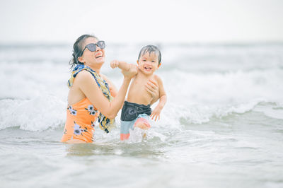 Father and son at sea shore