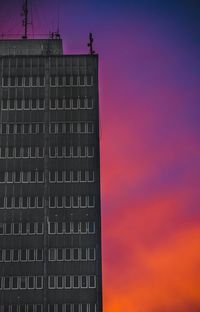 Low angle view of building against sky during sunset