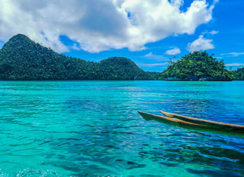 Scenic view of sea against blue sky