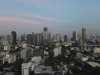 High angle view of buildings in city against sky