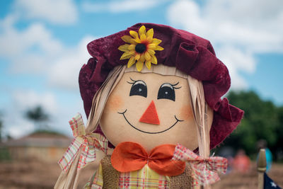Close-up of scarecrow against sky