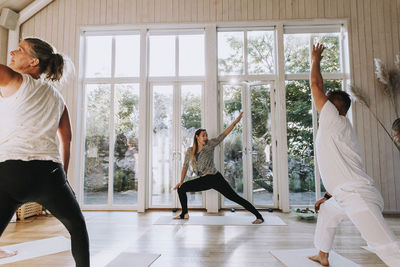 People practicing yoga in class