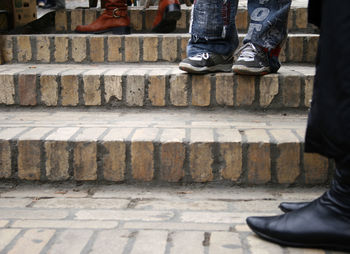 Low section of man walking on footpath