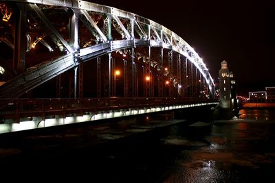 Bridge over river at night