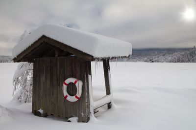 A small shelter in the bavarian alps at lake barmsee during winter