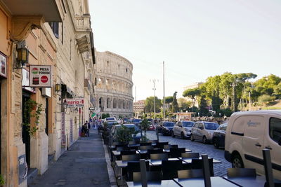 Street amidst buildings in city against clear sky