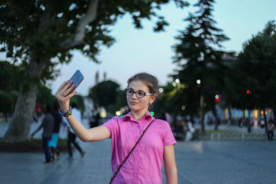 Portrait of woman photographing