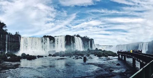 Panoramic view of waterfall against sky