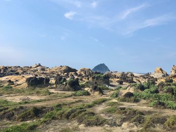 Rock formations on landscape against sky