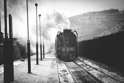 Steam train on railroad tracks