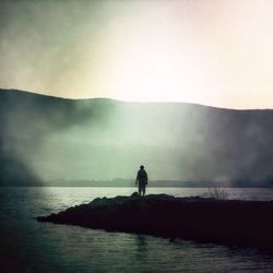 Silhouette people at sunset