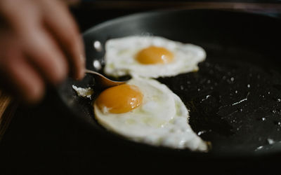 Close-up of eggs in frying pan