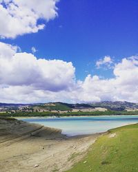 View of beach against cloudy sky