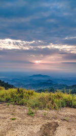 Scenic view of field against sky during sunset