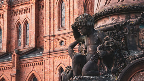 Low angle view of statue of historic building