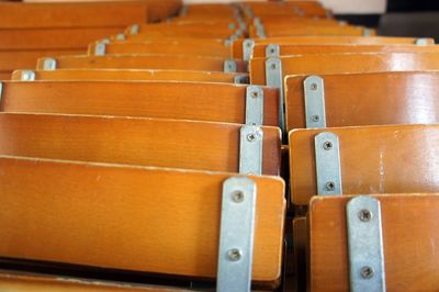 Full frame shot of empty wooden chairs