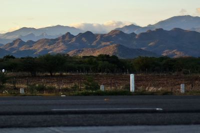 Country road leading towards mountains