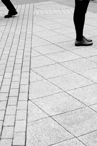 Low section of people standing on floor