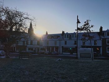 Buildings against sky during sunset