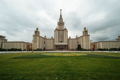 Buildings against cloudy sky