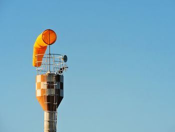 Low angle view of windsock against the sky