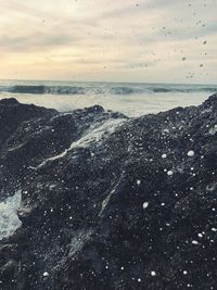 Scenic view of sea against sky at sunset