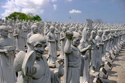 Panoramic view of statues against sky