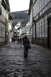 Rear view of man walking on street