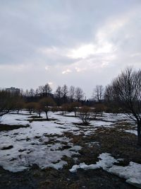 Scenic view of frozen lake against sky during winter