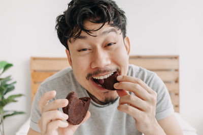 Portrait of man eating food