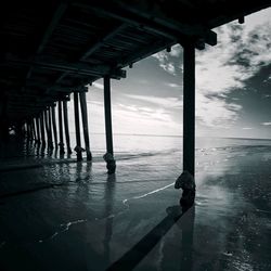 Below view of pier at henley beach against sky