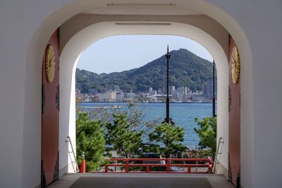 View of sea seen through arch window