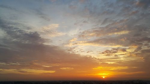 Scenic view of dramatic sky during sunset