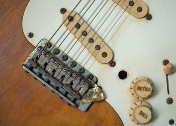 High angle view of guitar on table