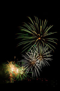 Low angle view of firework display at night