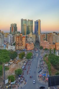 High angle view of city street and buildings against sky