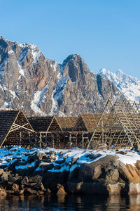 Scenic view of snowcapped mountains against clear blue sky