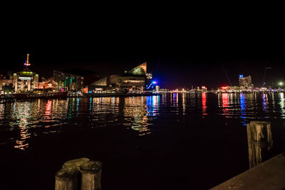 Illuminated city at waterfront