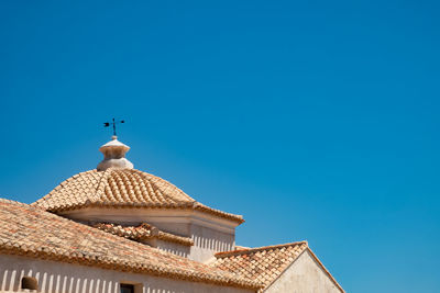 Low angle view of building against blue sky