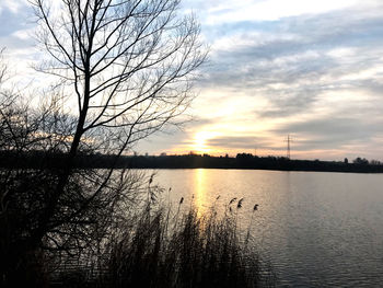 Scenic view of lake against sky during sunset