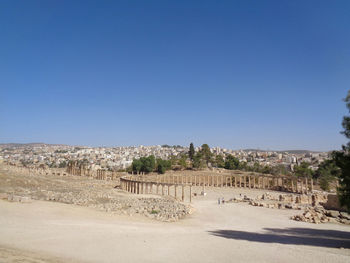 Panoramic view of castle against clear blue sky