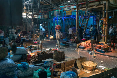 People working at market stall