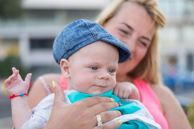 Portrait of mother holding baby