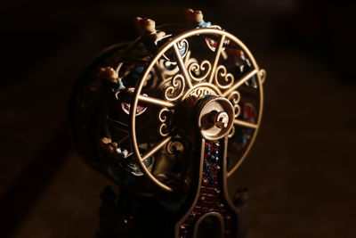 Close-up of antique toy on table in darkroom