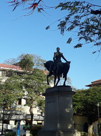 Low angle view of statue against sky