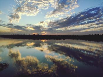 Scenic view of lake against sky during sunset