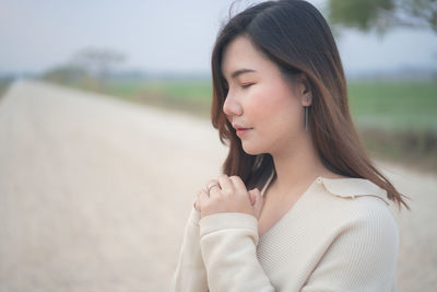 Portrait of beautiful woman standing outdoors