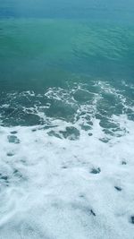 High angle view of sea against blue sky