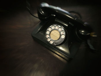 High angle view of telephone on table