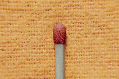 Close-up of matchstick on table